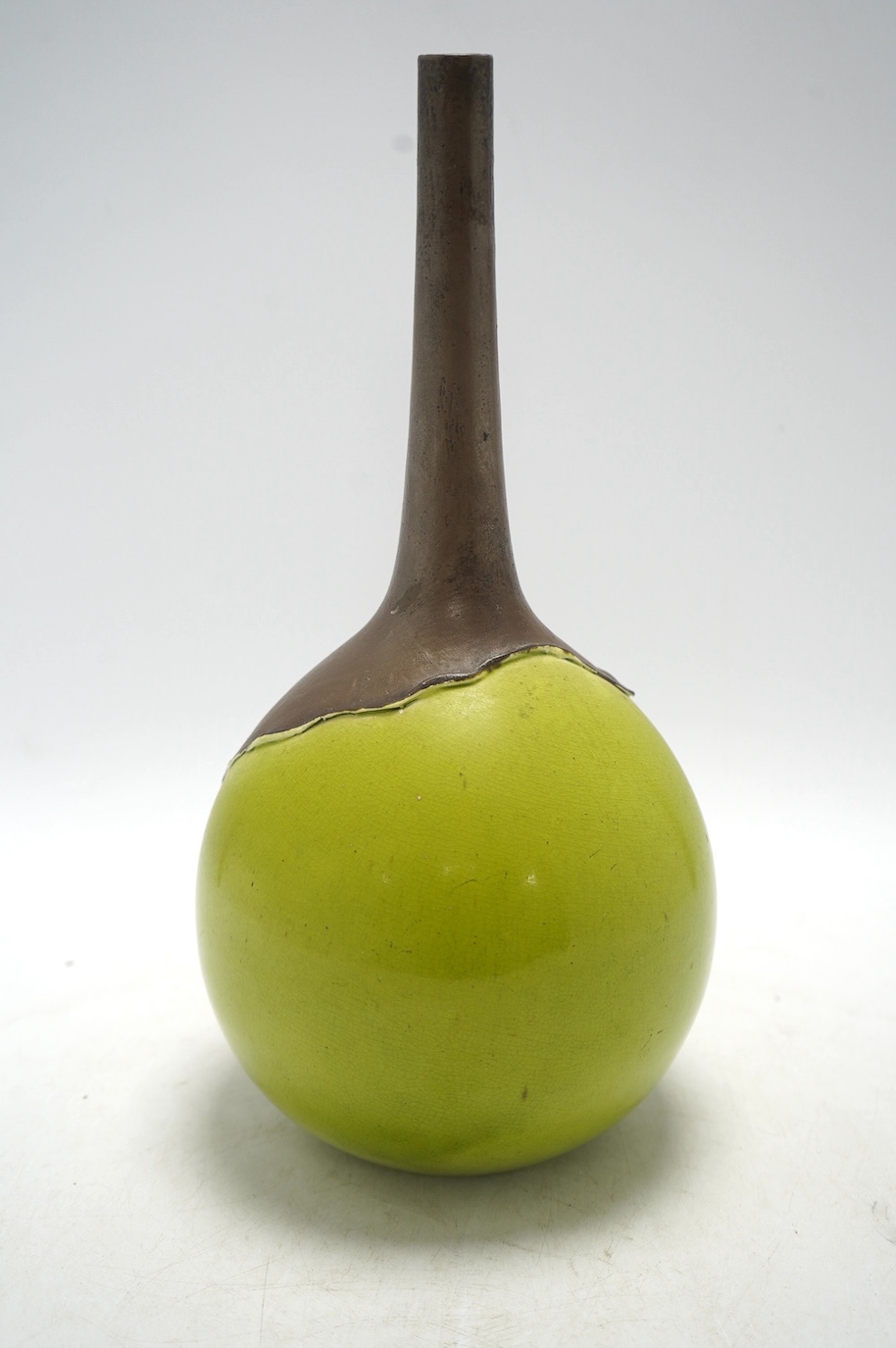 A Bretby two tone green and brown bottle vase, 31cm. Condition - fair, general crazing